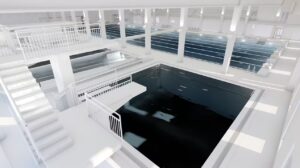 Havainnekuva uimahallin sisätiloista hyppyaltaan viereltä.